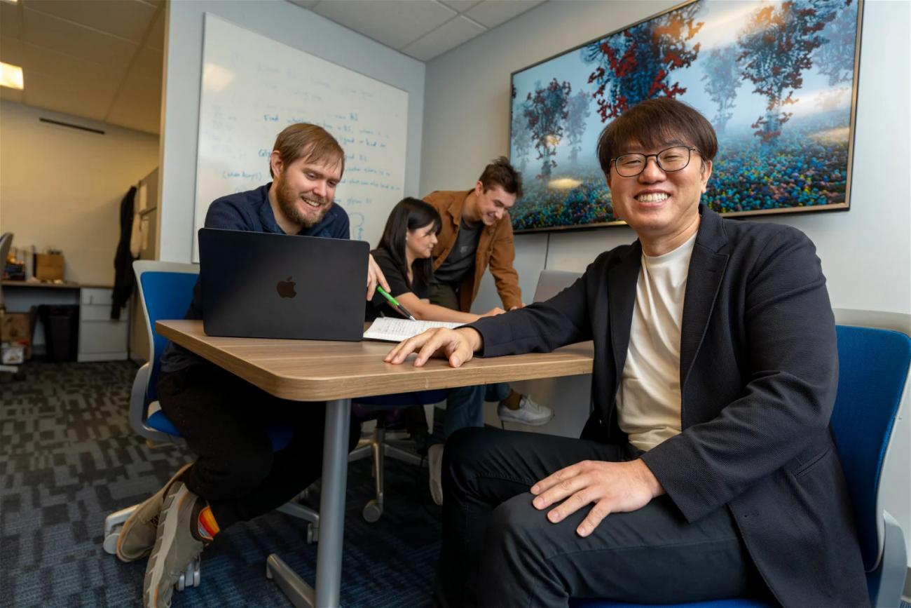 Lehigh University students sitting at a desk with a laptop and notepad